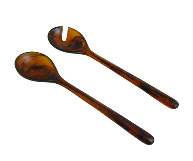 Set of two brown marbled salad serving utensils, one with a solid spoon, and one with a slotted spoon.
