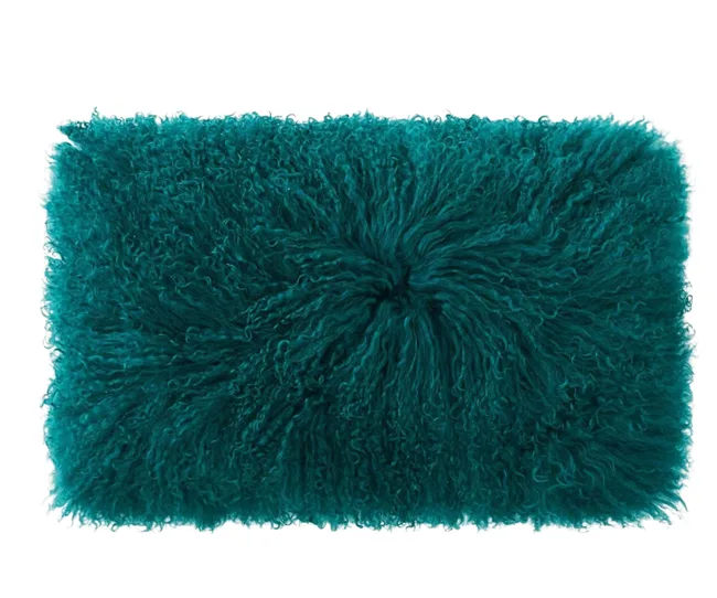 Fluffy teal Mongolian sheepskin decorative pillow with a textured surface.