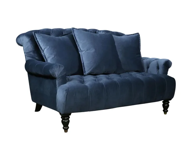 Navy blue tufted loveseat with rolled arms and three large cushions against a white background.