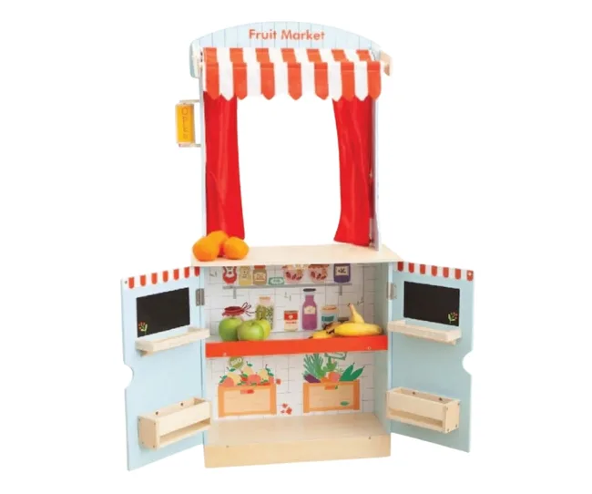 Wooden toy fruit market stand with striped canopy and colorful fruit displays.