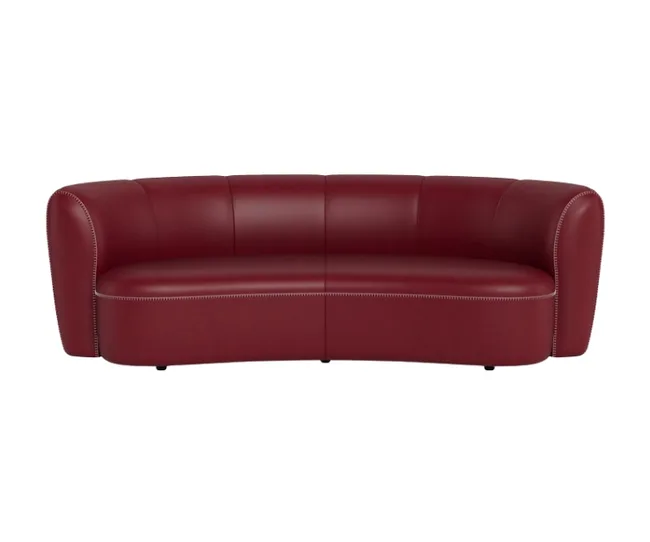 Curved red leather sofa with stitched detailing and rounded arms on a white background.