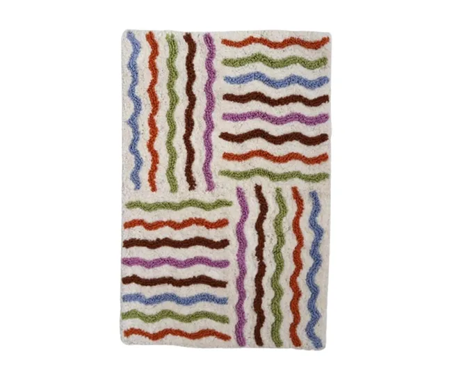 Multicolored wavy striped carpet with a textured pattern on a light beige background.