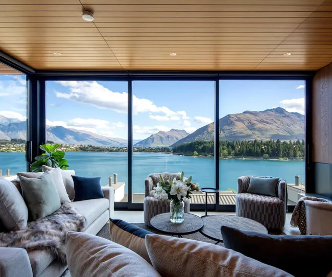 A living room with a wide view for Lake Wakatipu