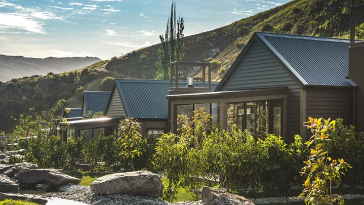 Chalets at Gibbston Valley in Queenstown with greenery