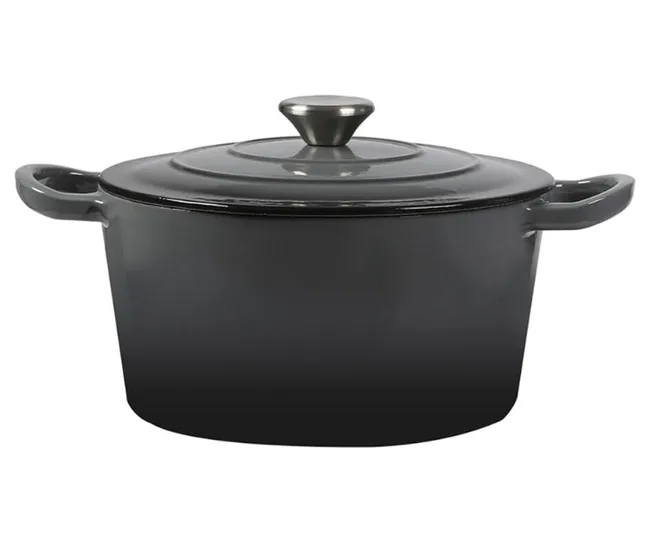 Black cast iron Dutch oven with handles and a lid, against a white background.