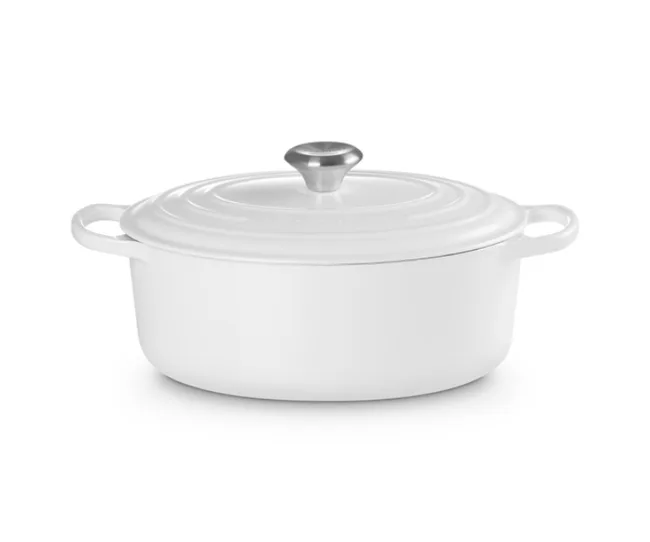 White oval cast iron cookware with lid and handles, featuring a shiny silver knob on top.