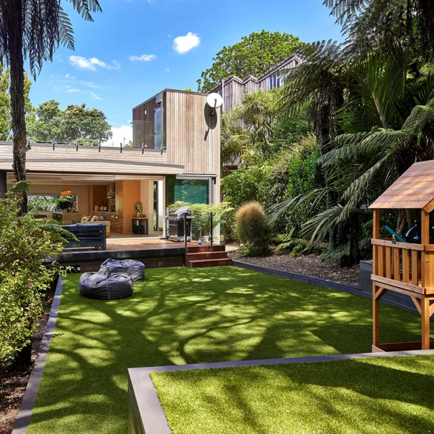 This Castor Bay backyard is fun, child-friendly and full of native greenery