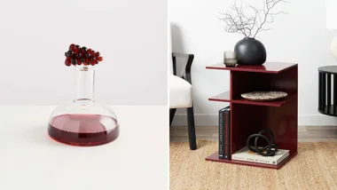 A decanter filled with wine and a burgundy side table