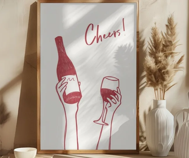a print of a red wine bottle and glass with the word 'cheers'