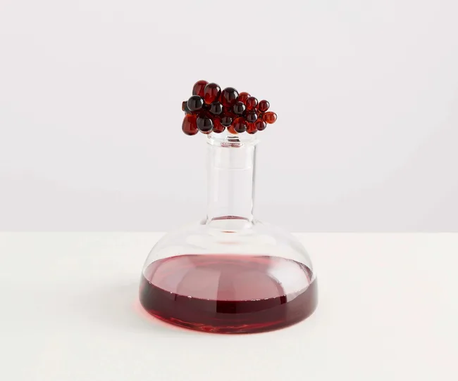 A wine decanter filled with red wine