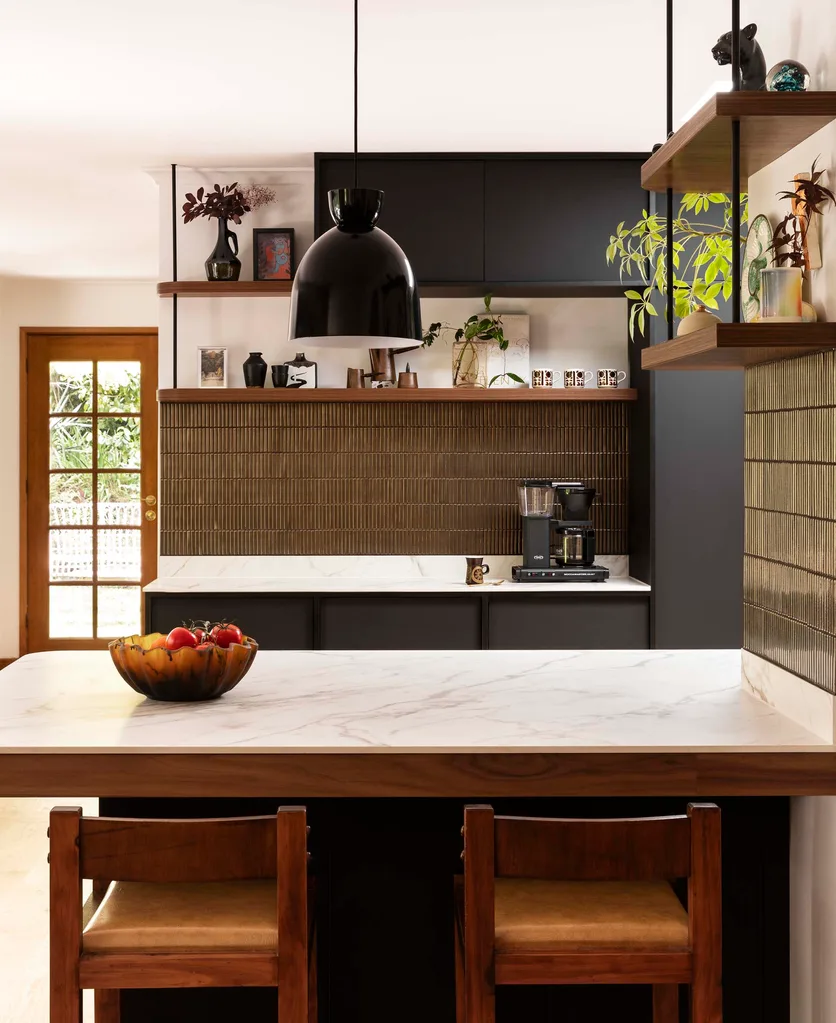 A Japanese-style kitchen with gold tiles as a backsplash
