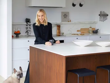 Olivia standing in the kitchen of her new Christchurch home
