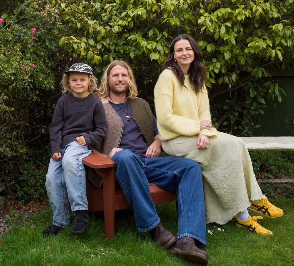Meg, Matt and son Murphy sitting on an outdoor bench