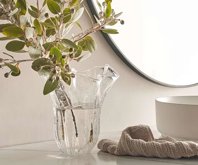 A clear vase with branches