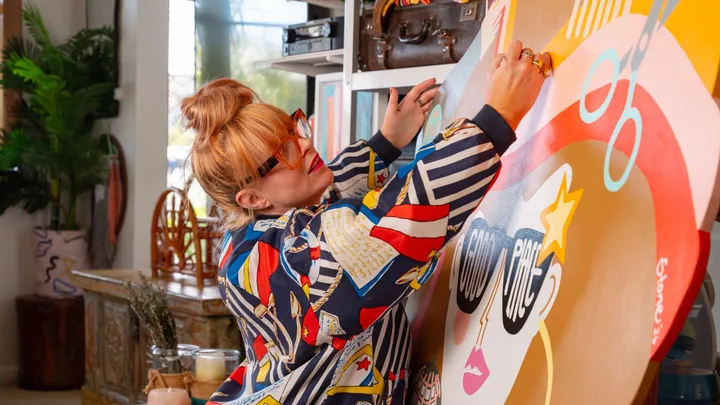 Rachael Stone working on a large piece of art in her studio