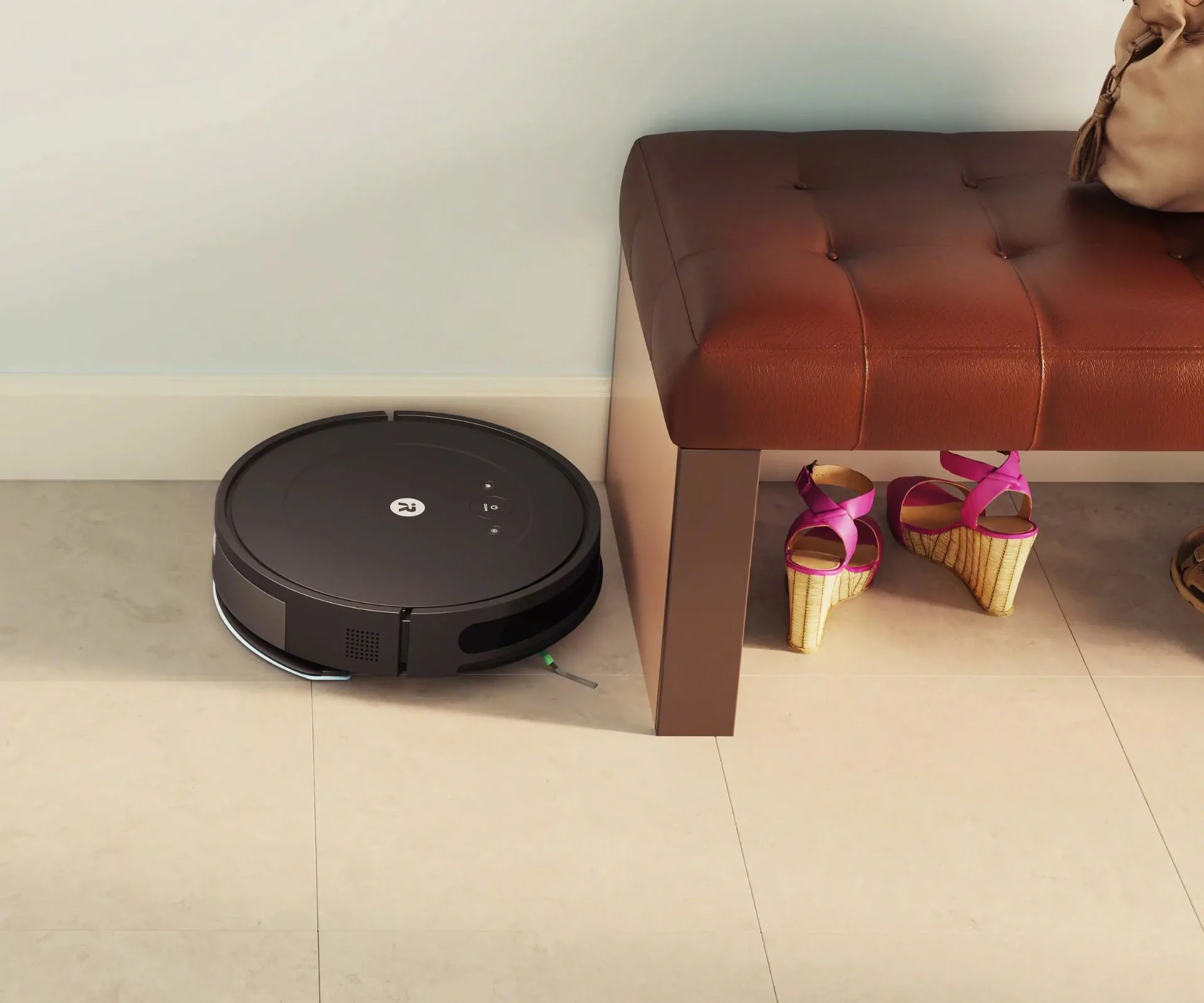 The iRobot Roomba working on the floor beside a bench