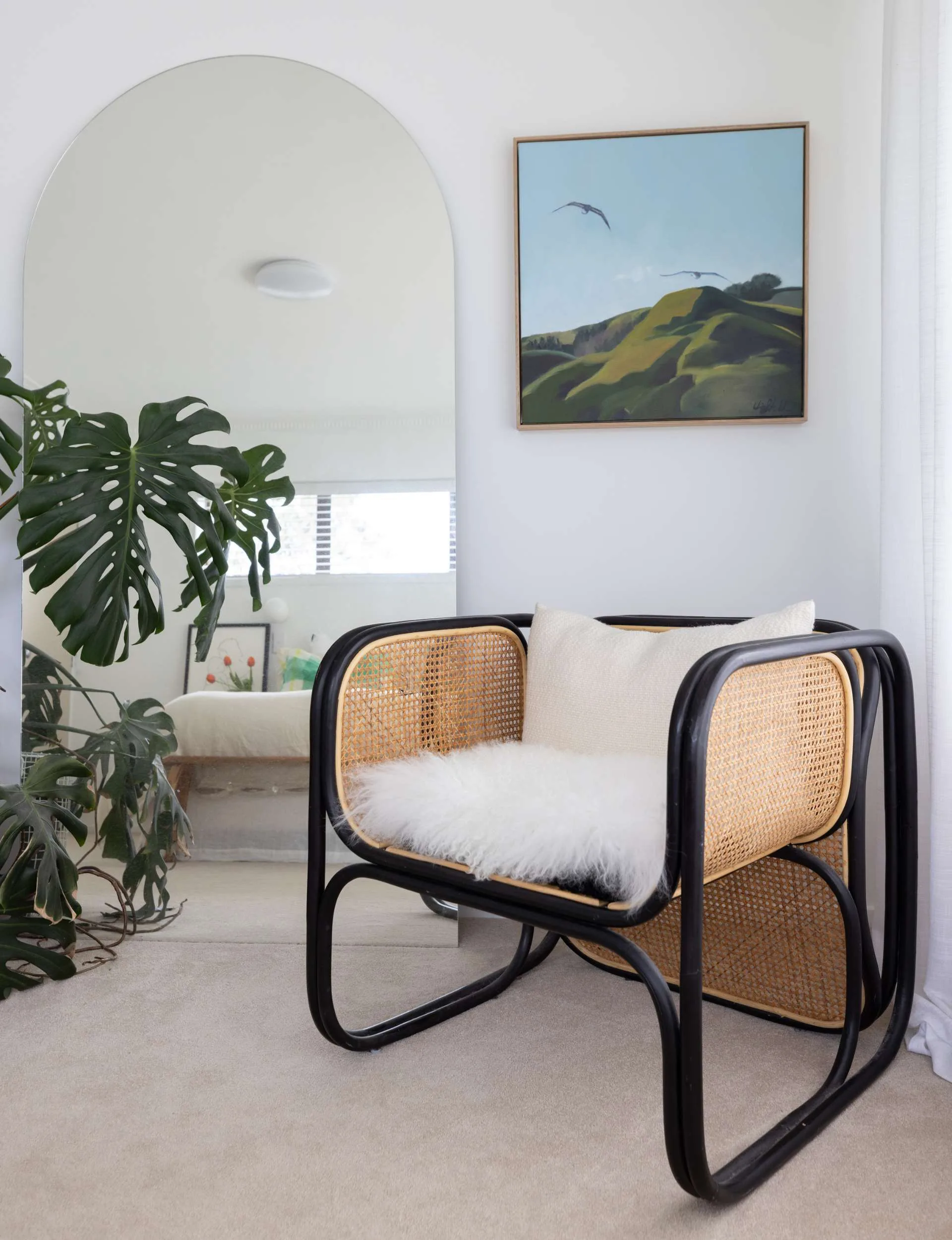 A chair in the corner of the Whangaparāoa home master bedroom