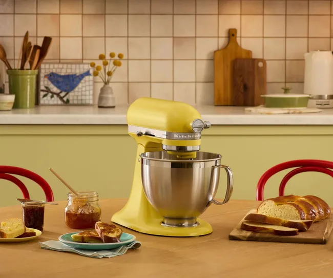 A KitchenAid stand mixer on a kitchen bench