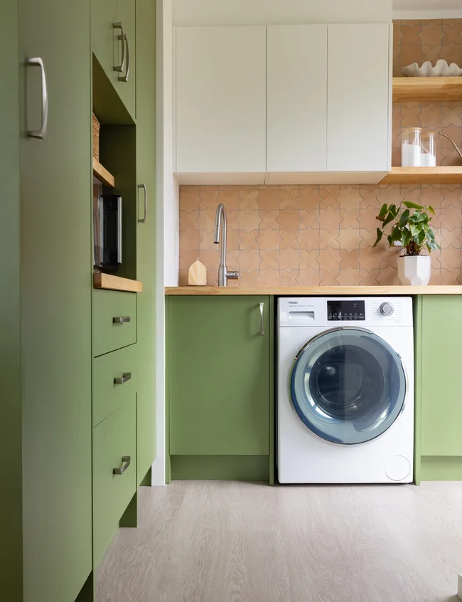 Green laundry room in Pearson renovation project