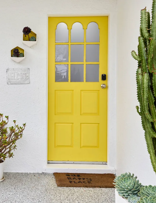 The Auckland art deco home bright yellow front door