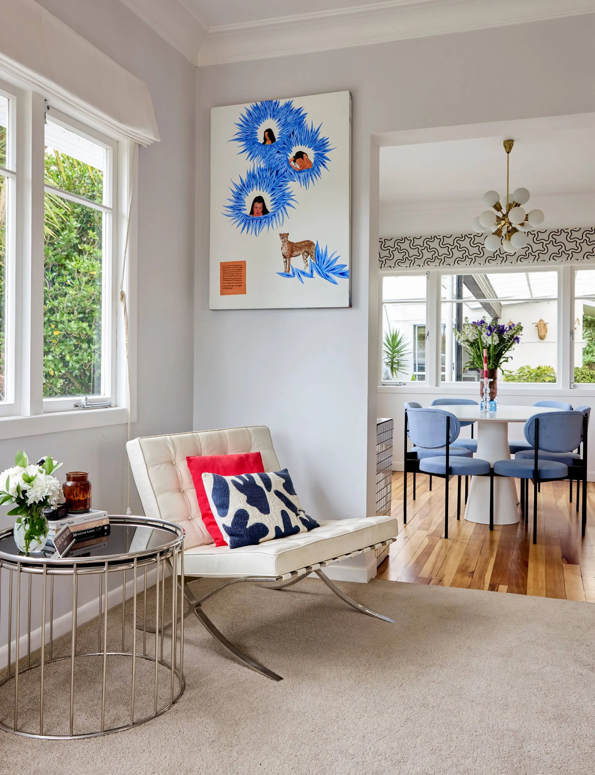 A white leather armchair in the corner of the living room