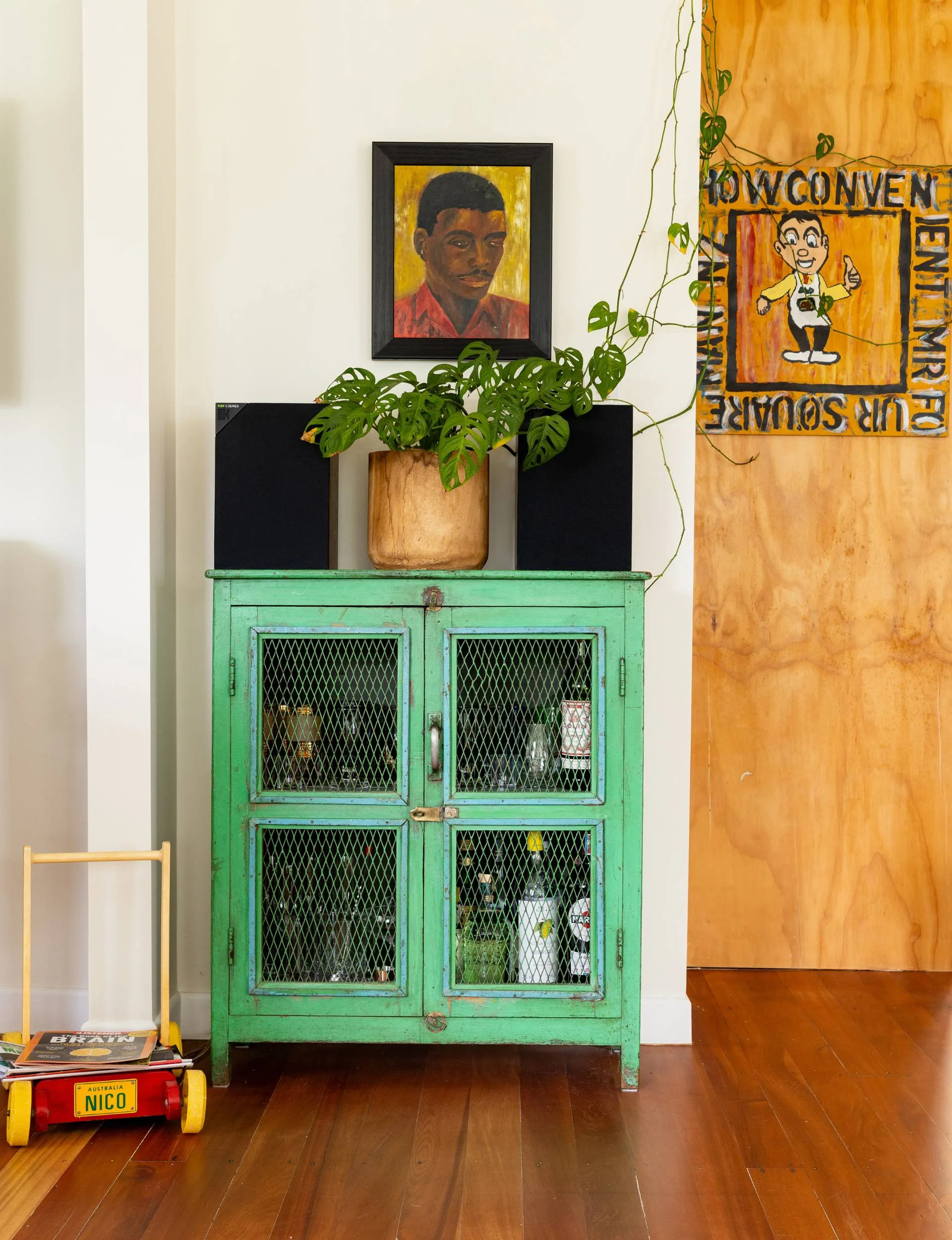 A lime green cabinet in the living room of the Point Wells bach