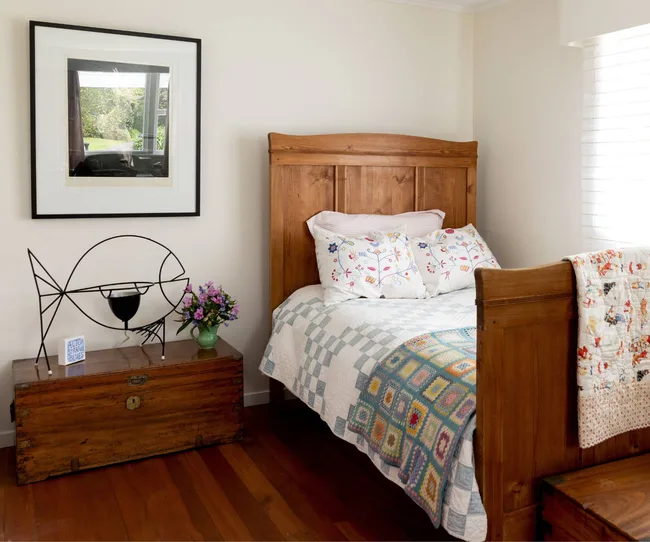 A spare bedroom in the Point Wells bach with a single bed in the corner