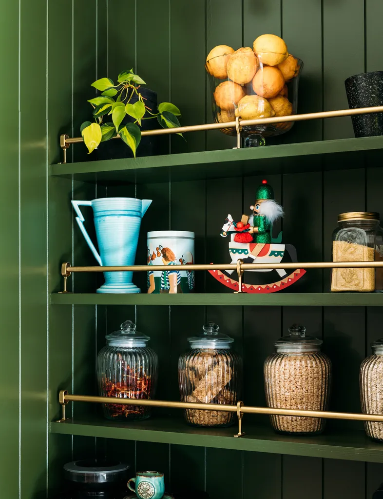 Dark green shelving unit
