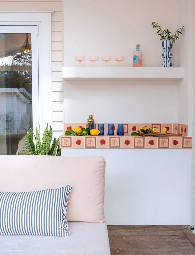 Decor on the living room shelves of the Wainui Beach bungalow