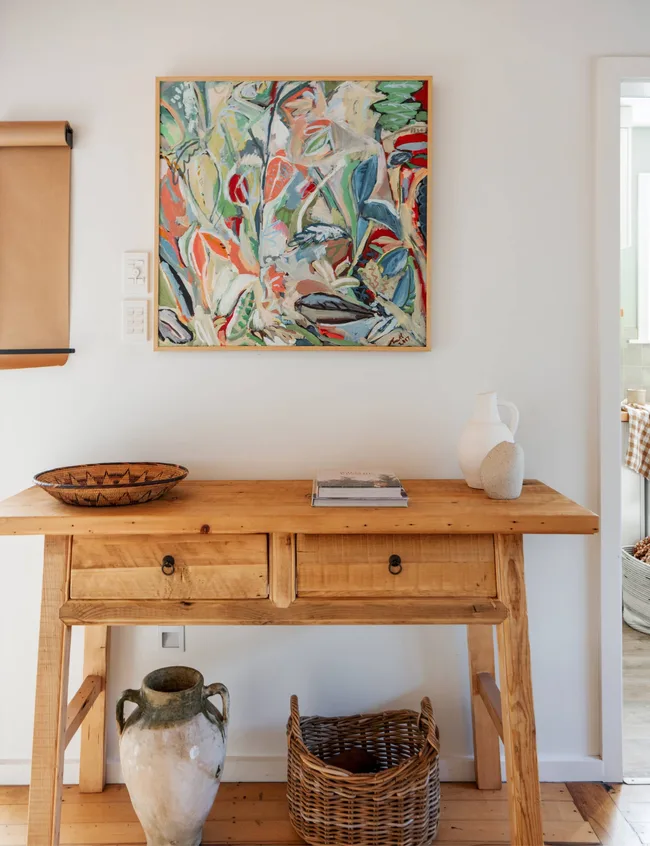 A hallway table in the Wainui Beach bungalow