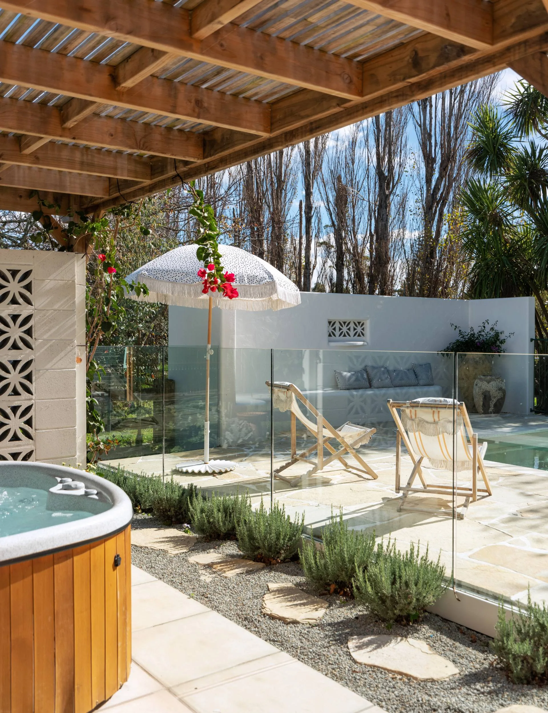 The spa and pool out the back of the Wainui Beach bungalow