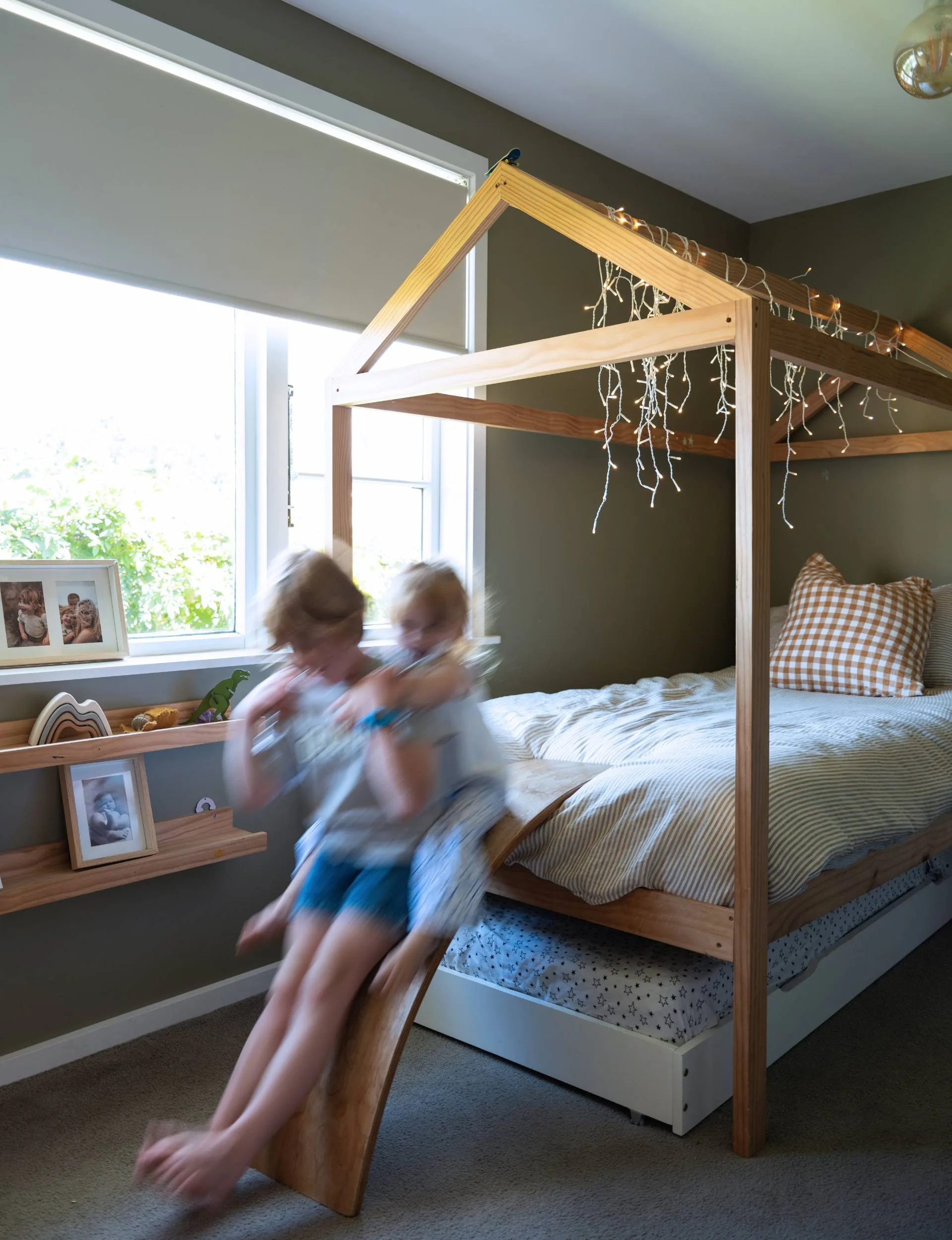 One of the kids' beds has a spare bed tucked neatly underneath it ad a slide off the end