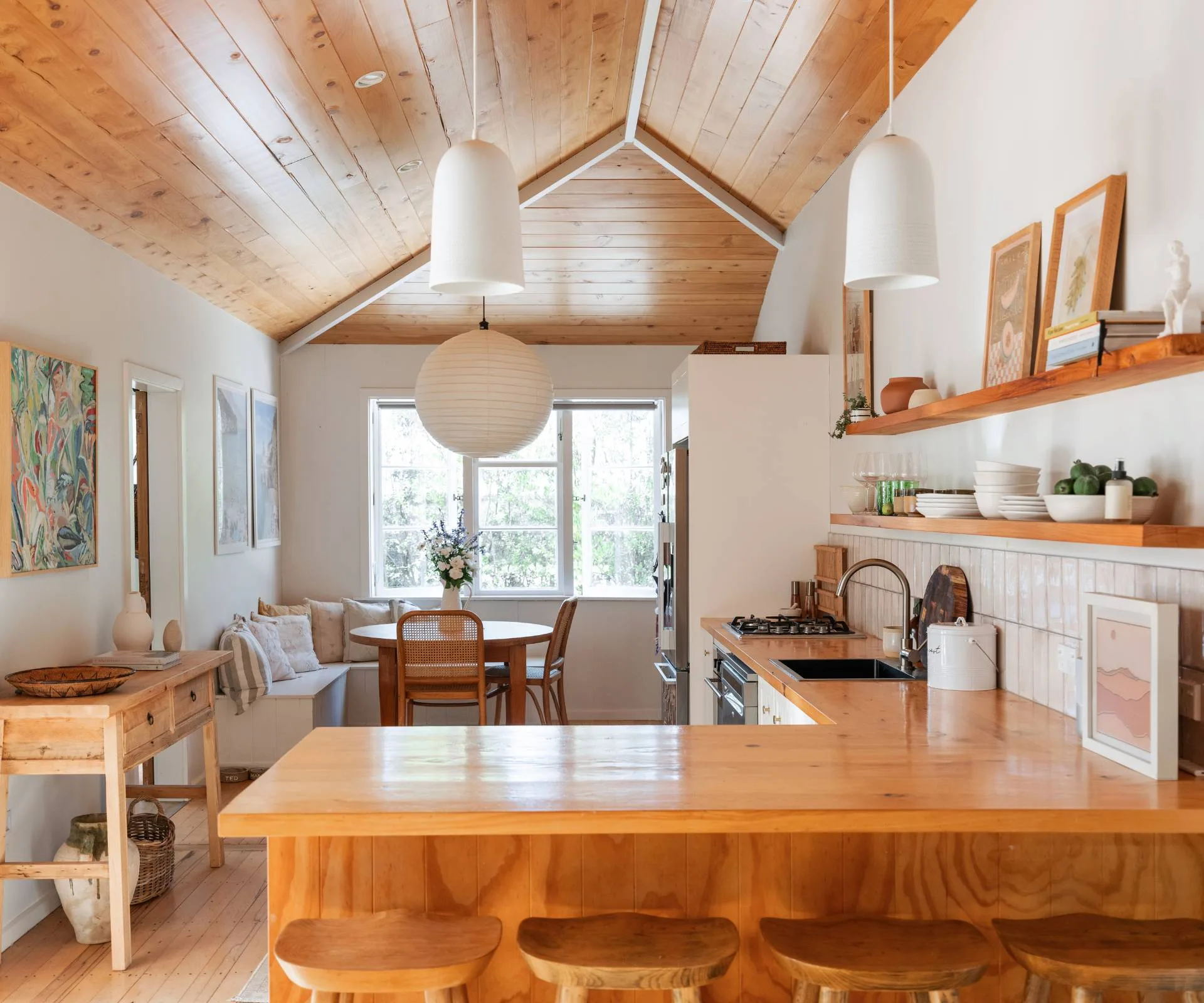 The Wainui Beach bungalow's wooden kitchen