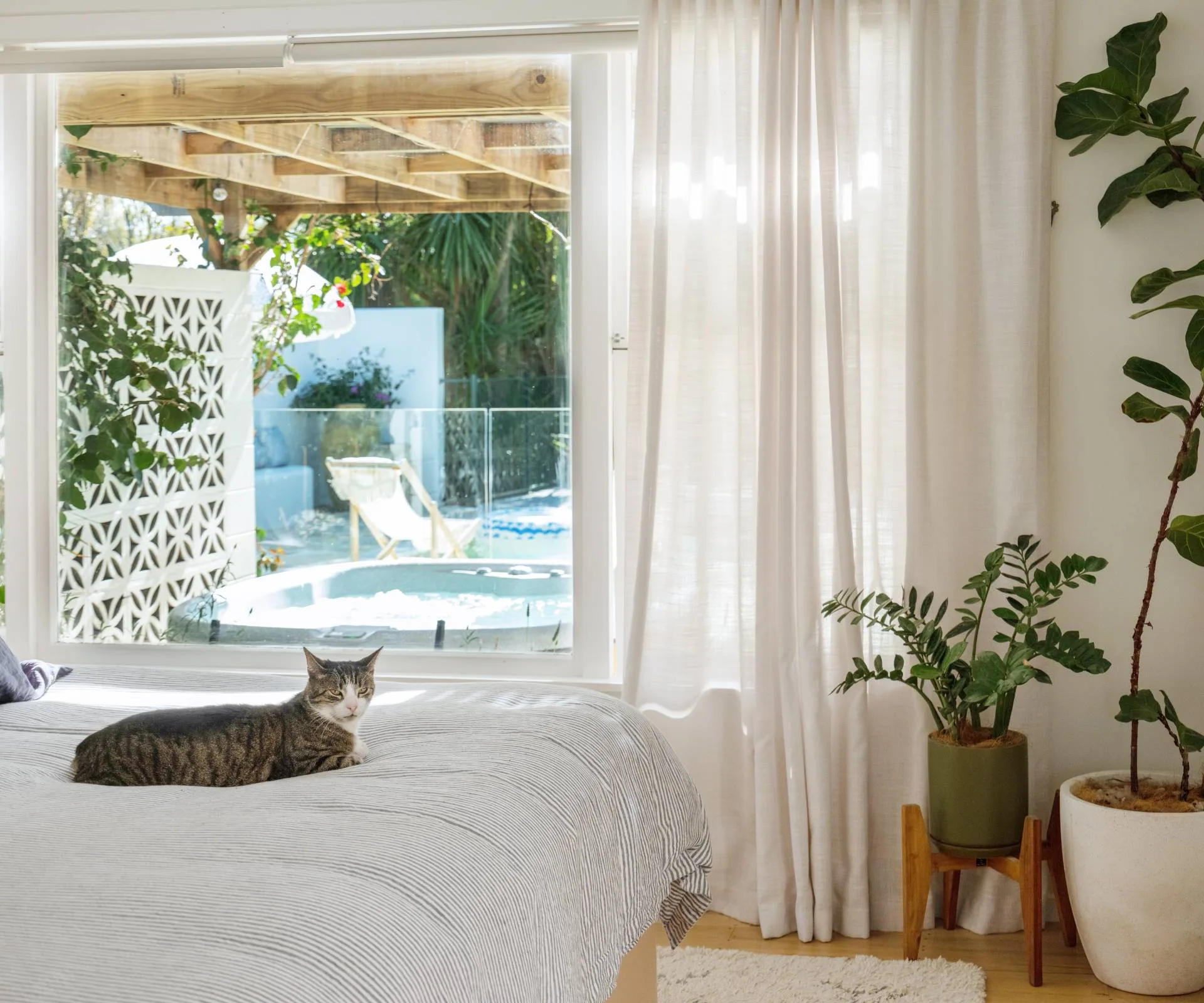 The view across the master bed into the spa and pool