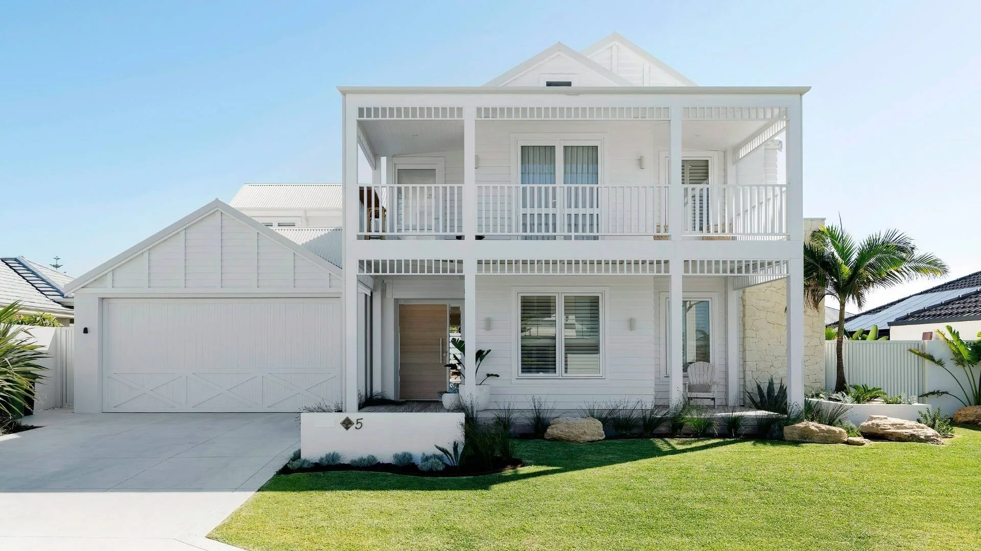 The street view of the two-storey Hamptons-style home