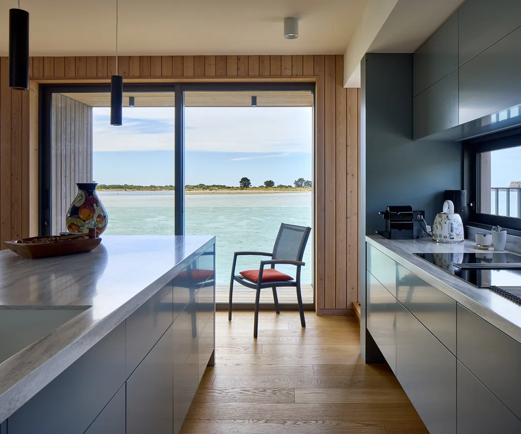 The kitchen has a view of the estuary at this Redcliffs home