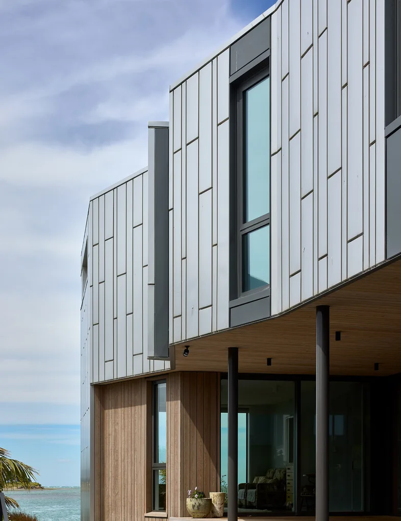 A contemporary larch- and stainless steel-clad two-storey Redcliffs house