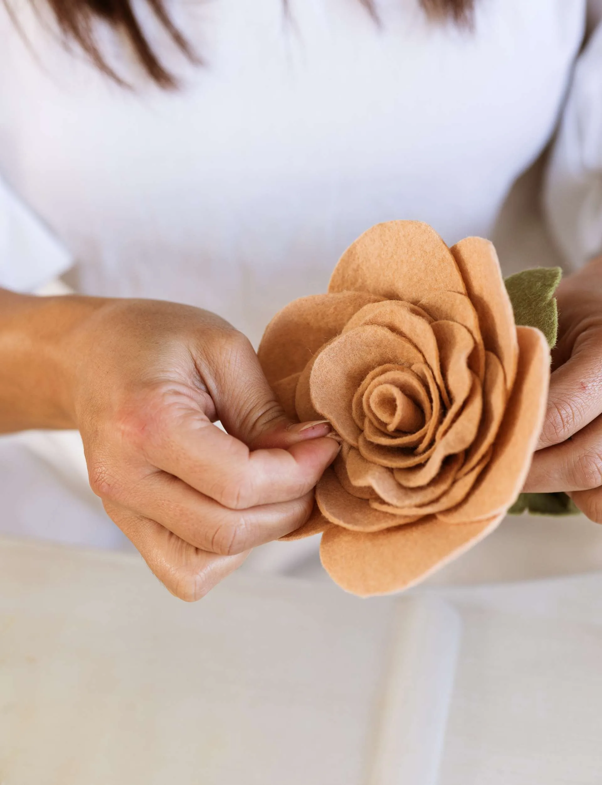 woman making felt flower