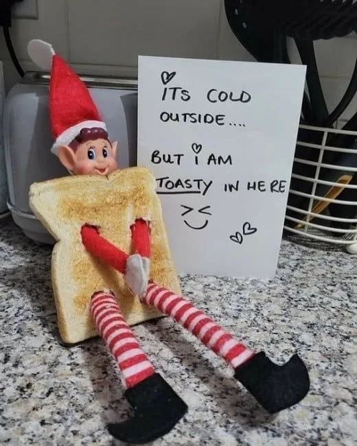 Elf on the Shelf wearing toast to stay warm