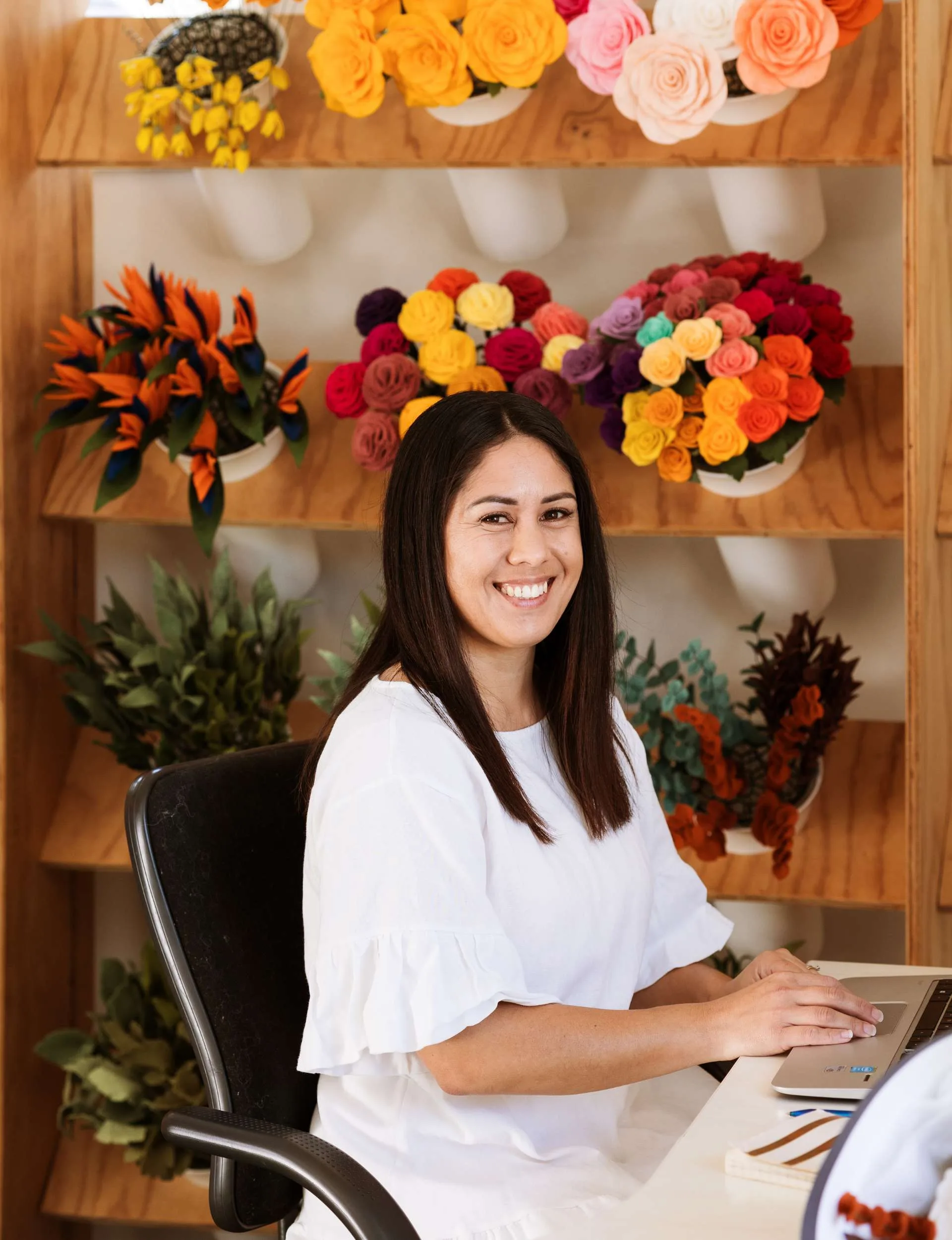 woman sitting at desk on her computer