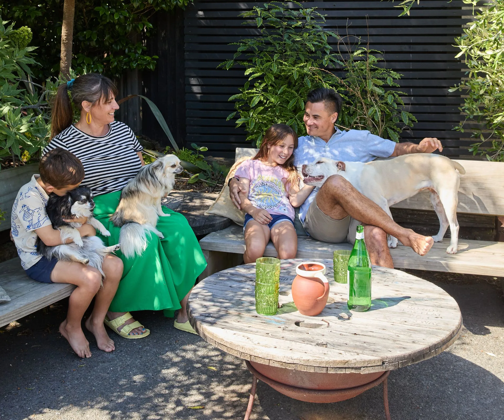 Liz, Nick and their kids and pups outside their Christchurch home