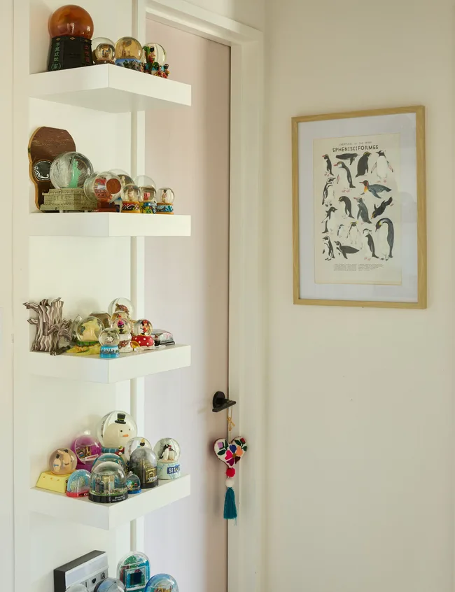 Shelves adorned with snow globes from Japan