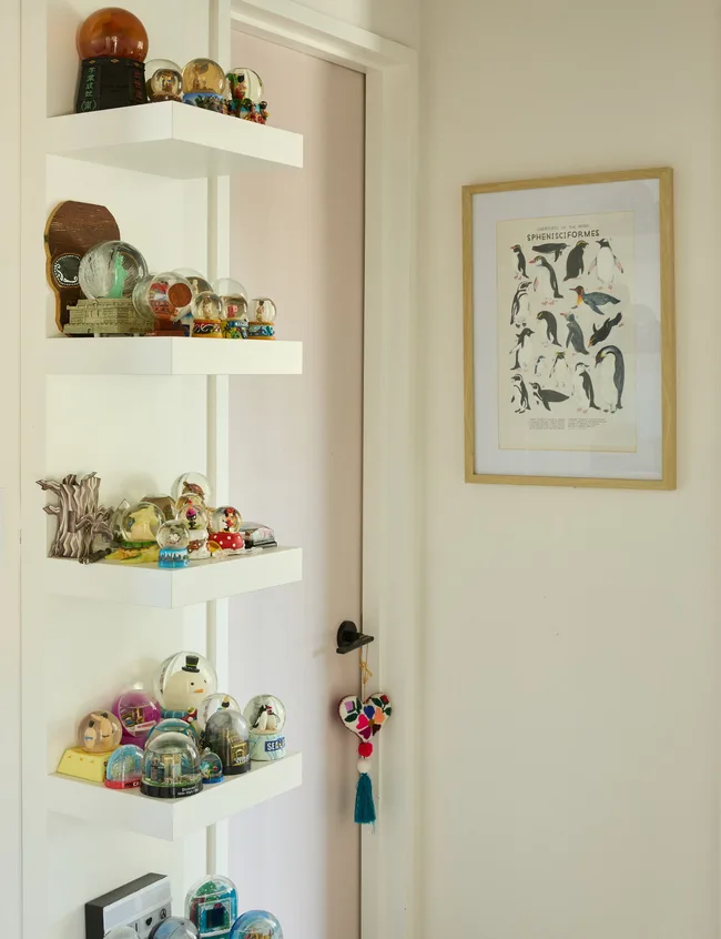 Shelves adorned with snow globes from Japan