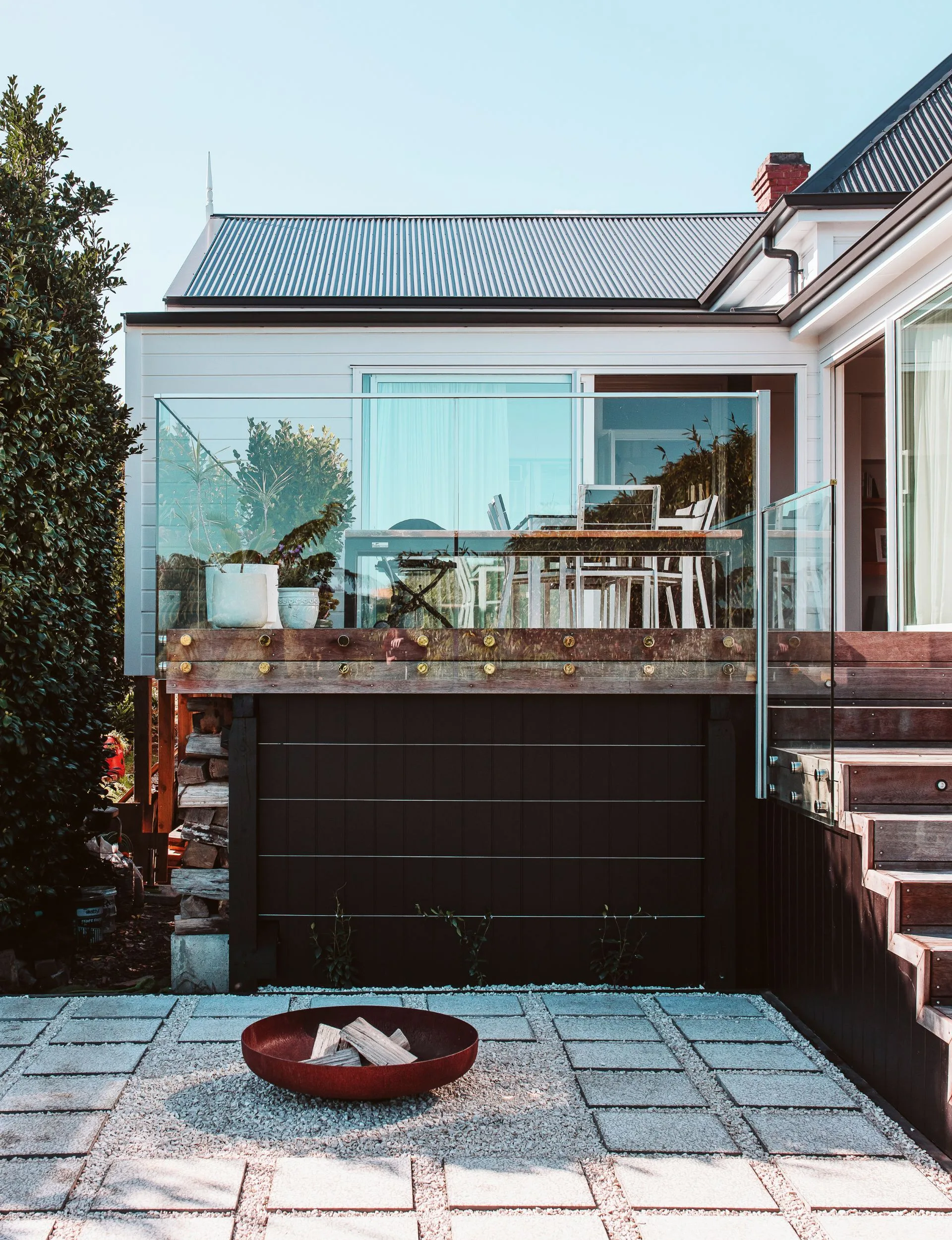 The balcony and fire pit of the renovated New Plymouth villa