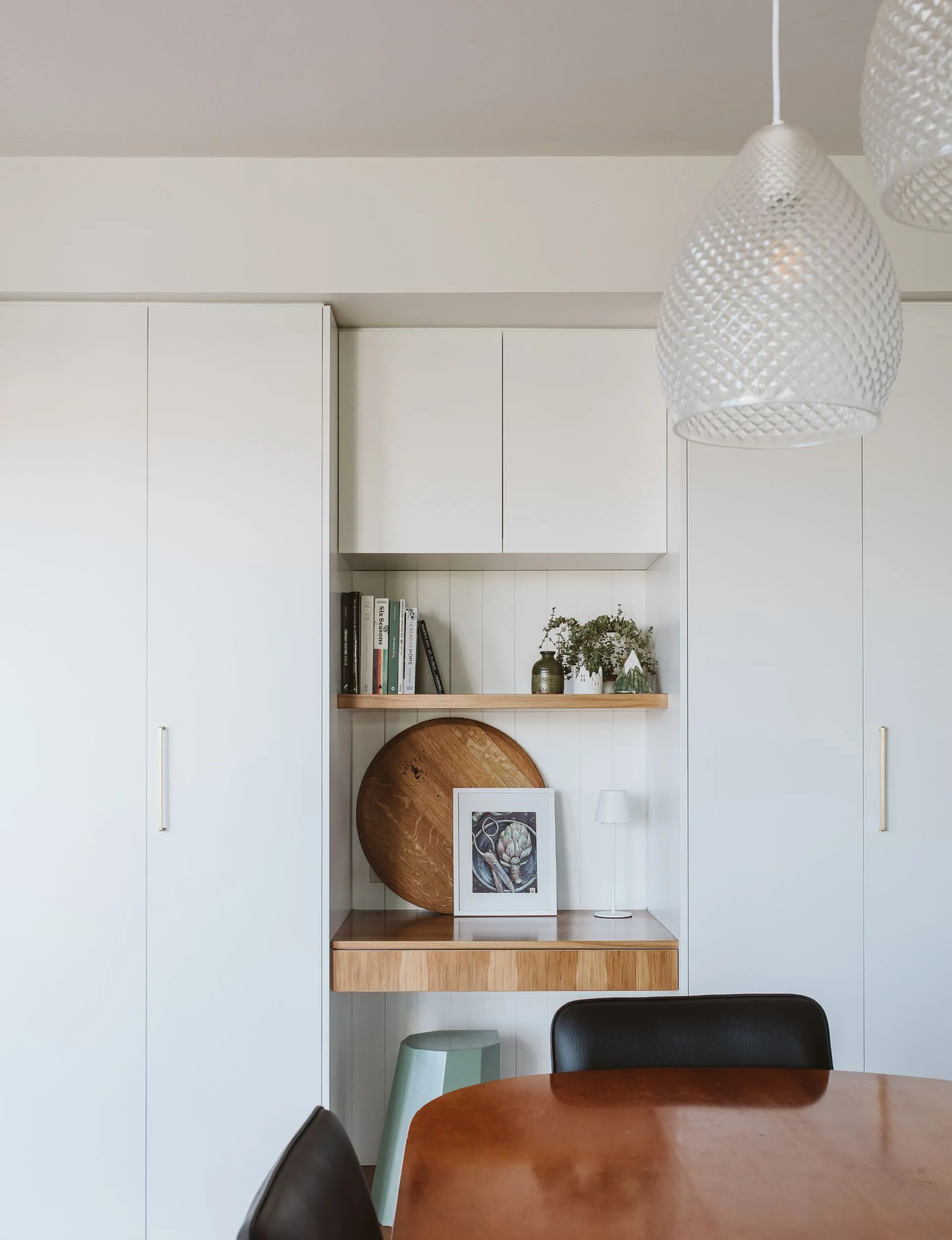 The renovated New Plymouth villa dining room table with a study nook behind
