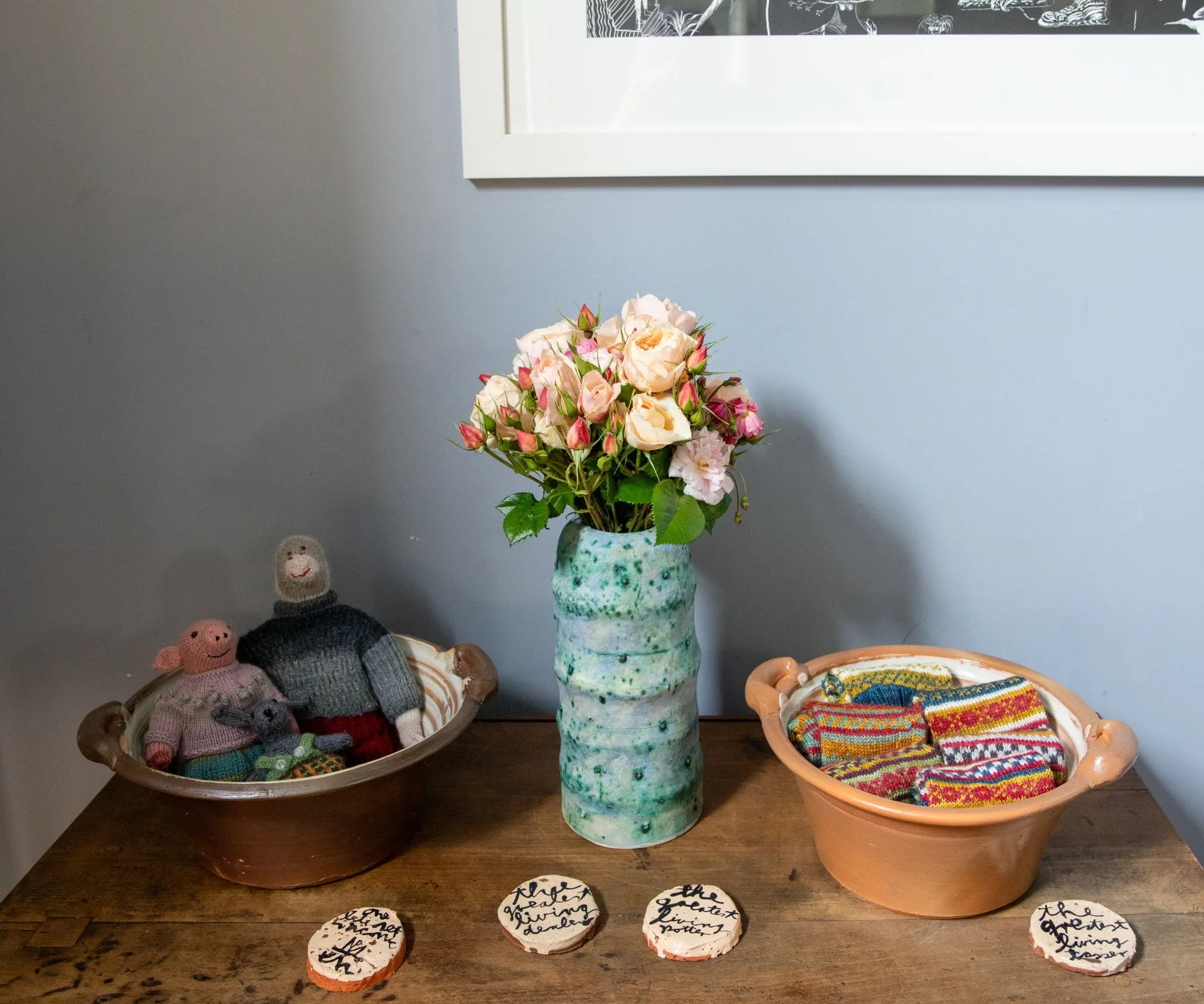 Flowers and pots of crafts on a table