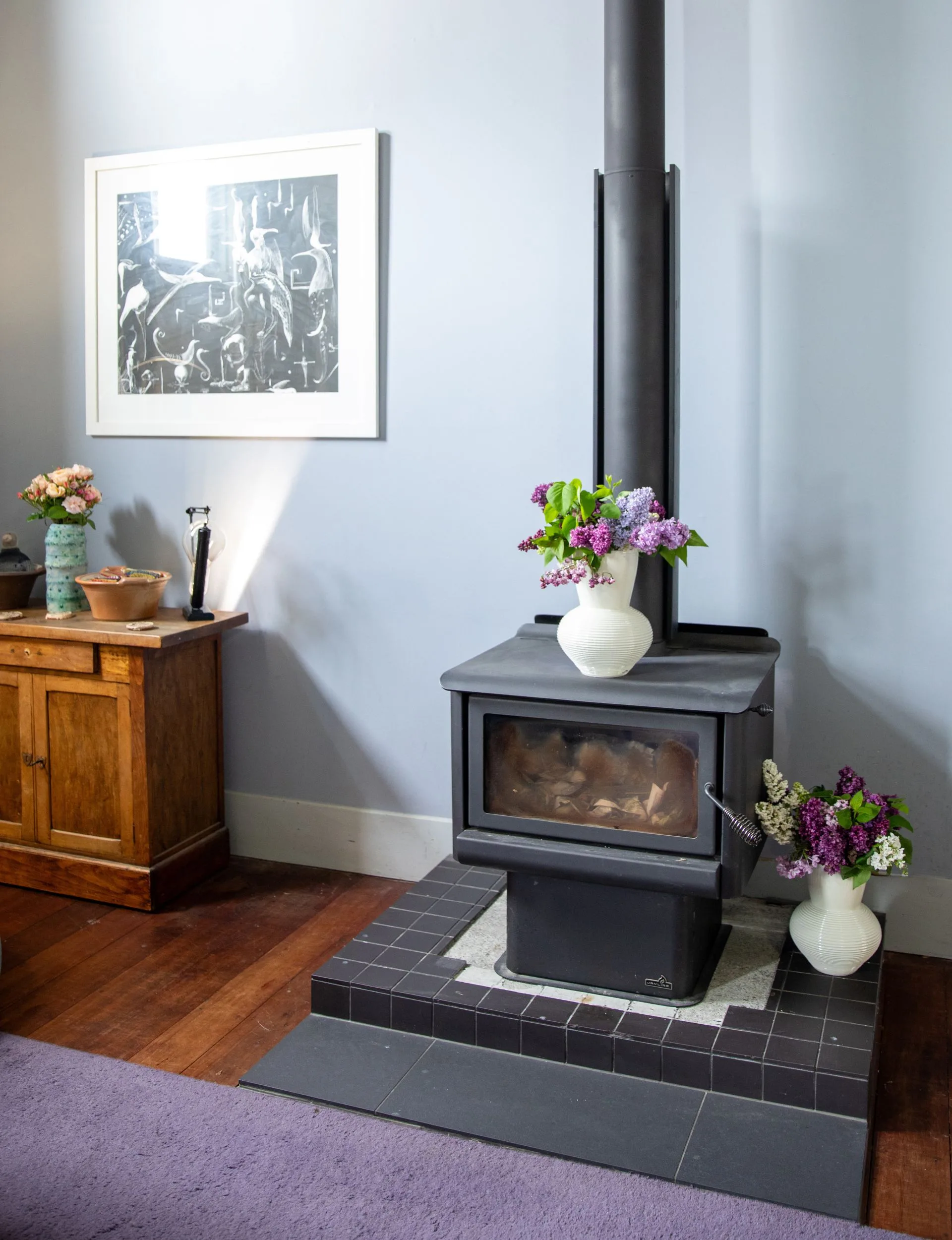 An old black fireplace in the living room