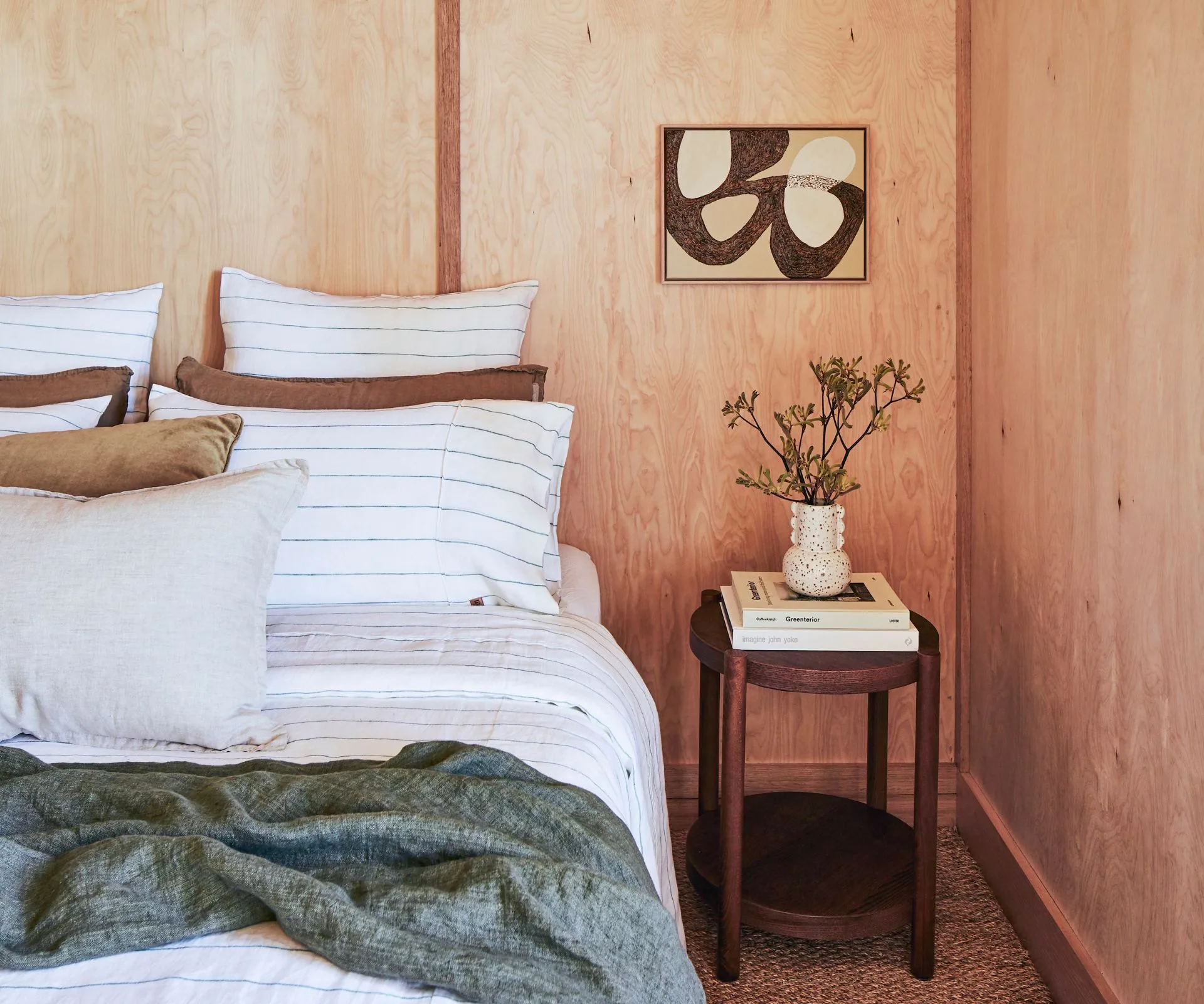 A plain second main bedroom with wooden walls