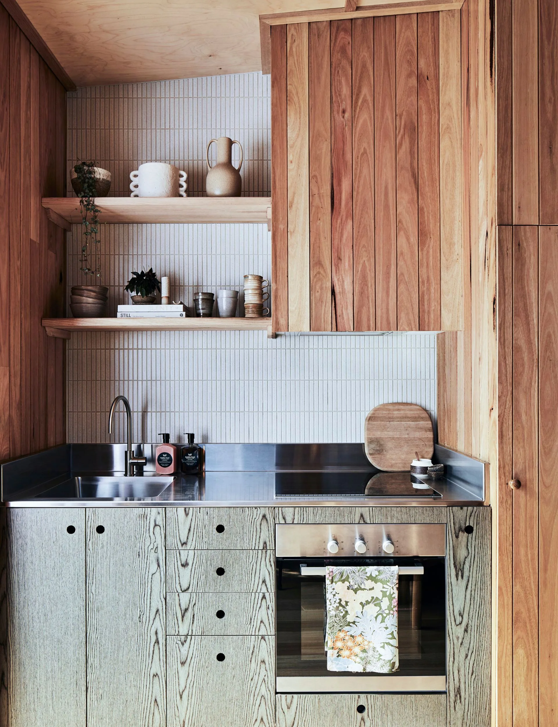 A Japanese style renovated kitchen which heroes ply wood in the beach cabin