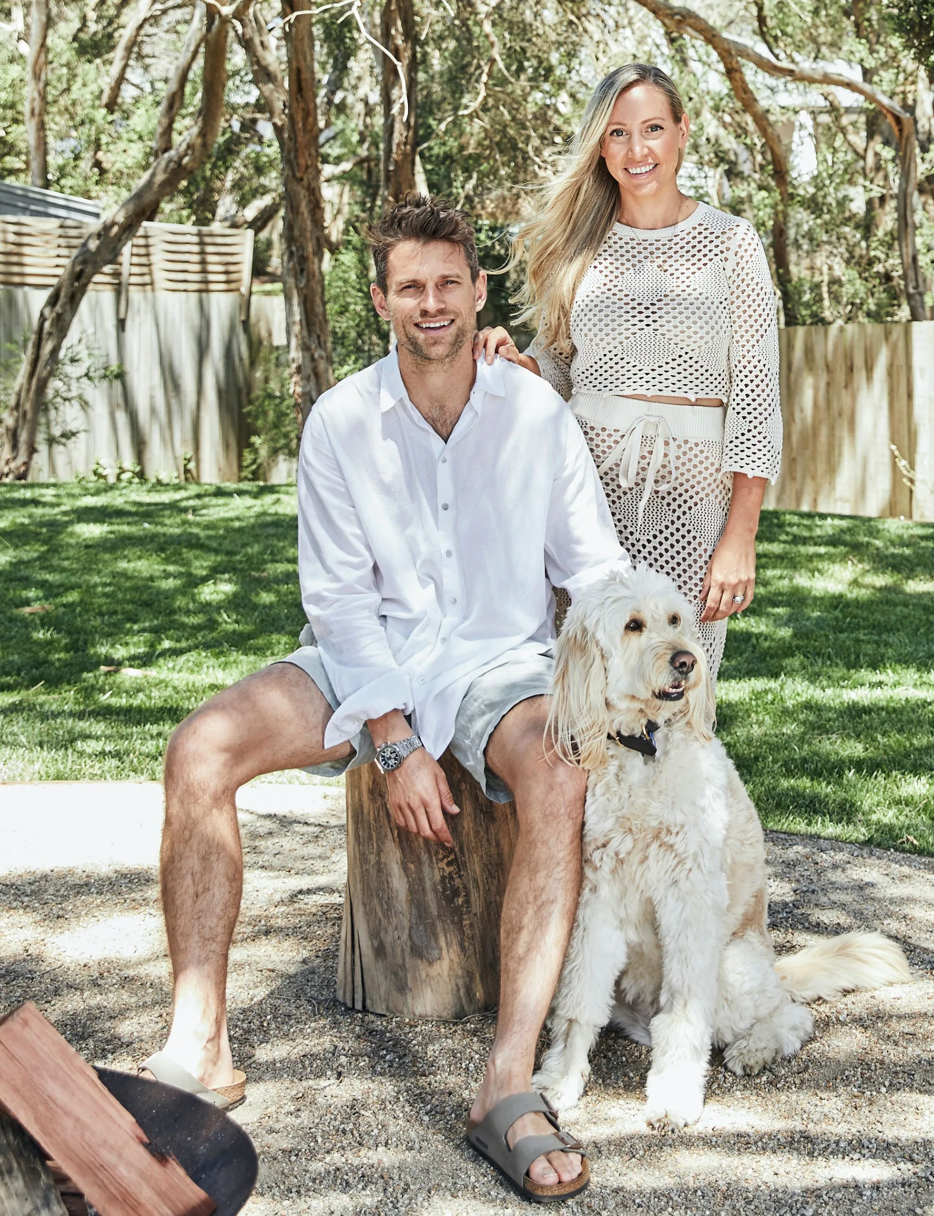 Homeowners outside with their dog